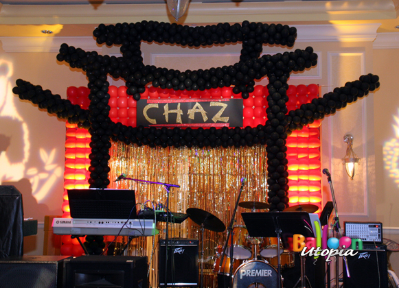 Stage backdrop sets the scene for Asian themed event