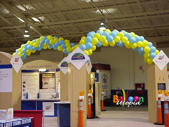 Framed arched high over head attract attention to this booth